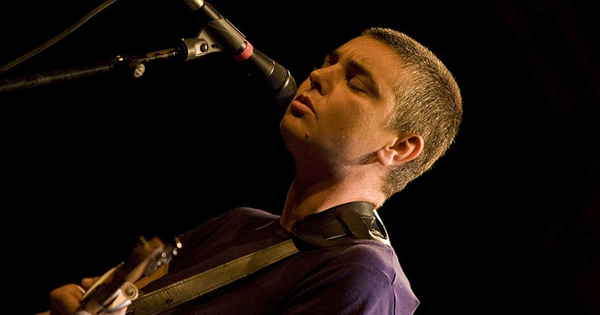 Sinéad O'Connor performing live on stage, Irish UK number one singer